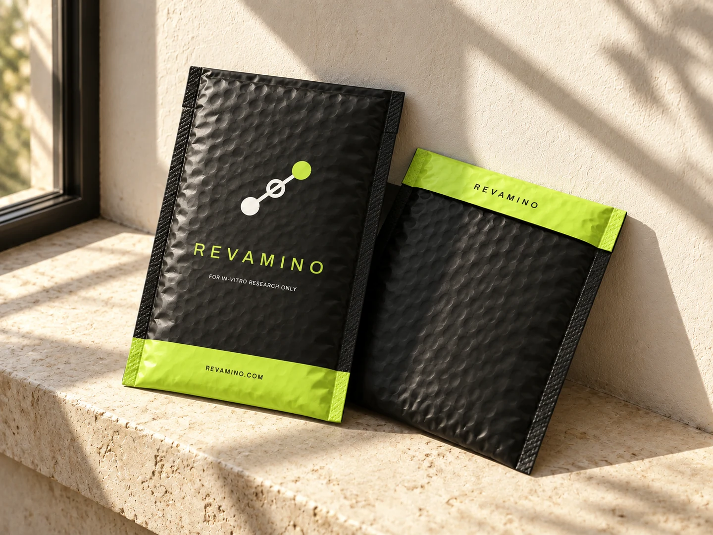 Revamino black-and-lime bubble mailers in warm window light